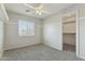 Bedroom with closet, window, and neutral walls at 14970 N 172Nd Dr, Surprise, AZ 85388