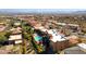 Aerial view of desert homes, featuring community pool, landscaping, and mountain views at 15834 E Sunflower Dr # 1, Fountain Hills, AZ 85268