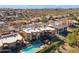 Aerial view of a desert residential area, featuring pools, homes, and greenery at 15834 E Sunflower Dr # 1, Fountain Hills, AZ 85268