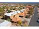 Stunning aerial view of a Southwestern-style home with a red tile roof nestled in a desert landscape at 15834 E Sunflower Dr # 1, Fountain Hills, AZ 85268