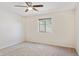 Bright bedroom features neutral carpet and a ceiling fan with light, plus window at 15834 E Sunflower Dr # 1, Fountain Hills, AZ 85268