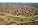 Picturesque aerial view of homes on the golf course, against a mountain backdrop at 16210 E Links Dr, Fountain Hills, AZ 85268