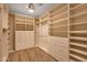 Walk-in closet with custom built-ins for organization and storage at 16210 E Links Dr, Fountain Hills, AZ 85268