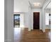 Bright entryway with wood floors and a decorative front door at 16210 E Links Dr, Fountain Hills, AZ 85268