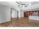 Open living space with wood floors connecting the kitchen to the living room at 16210 E Links Dr, Fountain Hills, AZ 85268