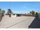 Large, fenced backyard with a covered patio and a spacious gravel area at 1709 W Clarendon Ave, Phoenix, AZ 85015