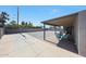 Covered patio with furniture overlooking a large, fenced backyard at 1709 W Clarendon Ave, Phoenix, AZ 85015