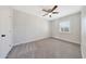 Bedroom featuring plush carpet and a large window for natural light at 1709 W Clarendon Ave, Phoenix, AZ 85015