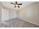 Bedroom showcasing neutral walls, plush carpet, and two doors at 1709 W Clarendon Ave, Phoenix, AZ 85015