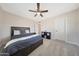 Spacious bedroom with a ceiling fan and plush carpet at 1709 W Clarendon Ave, Phoenix, AZ 85015