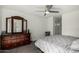 Neutral bedroom featuring a ceiling fan, mirrored closet, and wood dresser at 1717 E Union Hills Dr # 1065, Phoenix, AZ 85024