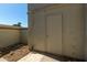 Exterior shot of the property showing a storage shed, stucco wall, rock ground cover at 1717 E Union Hills Dr # 1065, Phoenix, AZ 85024