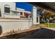 Exterior view showcasing architectural details, private courtyard, and mature landscaping of the property at 1717 E Union Hills Dr # 1065, Phoenix, AZ 85024