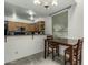 Well-lit kitchen and dining area featuring sleek countertops and functional cabinets at 1717 E Union Hills Dr # 1065, Phoenix, AZ 85024