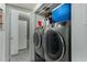 Laundry room featuring large modern dryer and washing machine at 1717 E Union Hills Dr # 1065, Phoenix, AZ 85024