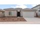 Charming single-story home with a two-car garage and low maintenance desert landscaping at 17843 W Encinas Ln, Goodyear, AZ 85338