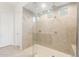 Large shower with stylish tile, multiple shower heads, and natural lighting at 18166 E Colt Dr, Queen Creek, AZ 85142