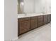 The bathroom features a double vanity with dark wood cabinets and white countertop at 18166 E Colt Dr, Queen Creek, AZ 85142