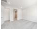 Spacious bedroom with neutral carpet and access to a modern bathroom at 18166 E Colt Dr, Queen Creek, AZ 85142