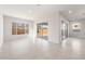 Bright living area featuring tile floors, sliding glass doors, and large windows at 18166 E Colt Dr, Queen Creek, AZ 85142