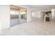Open living area with tile flooring and sliding glass doors leading to an outdoor space at 18166 E Colt Dr, Queen Creek, AZ 85142