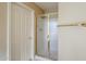 Bathroom featuring a framed glass shower, towel rack, and neutral colored walls at 19507 N 90Th Ln, Peoria, AZ 85382