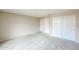 Bedroom featuring a large closet, neutral walls and carpet flooring at 19507 N 90Th Ln, Peoria, AZ 85382