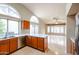 Kitchen with a breakfast bar that opens up to the living room, stainless steel dishwasher and sink at 19507 N 90Th Ln, Peoria, AZ 85382