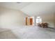 Living room featuring new carpet, a dining room table, and lots of natural light at 19507 N 90Th Ln, Peoria, AZ 85382