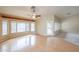 Large living room area featuring wood flooring and plenty of natural light from the many windows at 19507 N 90Th Ln, Peoria, AZ 85382