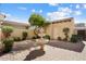 Charming backyard featuring a brick patio, lush greenery, and a tiered fountain at 21141 W Main St, Buckeye, AZ 85396