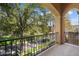 Balcony view overlooking a tree lined street and green space at 21141 W Main St, Buckeye, AZ 85396