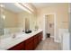 Neutral bathroom features dual sinks, a large mirror, and tiled floors at 21141 W Main St, Buckeye, AZ 85396