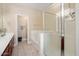 Bathroom featuring glass shower, soaking tub, and dual sink vanity at 21141 W Main St, Buckeye, AZ 85396