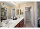 Bathroom with double sink vanity and adjoining room with bathtub at 21141 W Main St, Buckeye, AZ 85396