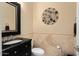 Powder bathroom featuring marble countertops and a black vanity at 21141 W Main St, Buckeye, AZ 85396