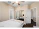 Bedroom featuring ensuite bath access and mirrored closet doors at 21141 W Main St, Buckeye, AZ 85396