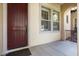 Close-up of the entryway features a handsome door and bright sidelight windows for a welcoming feel at 21141 W Main St, Buckeye, AZ 85396