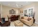 Comfortable living area featuring neutral tones and an abundance of natural light from plantation shutters at 21141 W Main St, Buckeye, AZ 85396