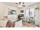 Bright bedroom featuring a daybed, work desk, and storage shelves at 22412 N 20Th Pl, Phoenix, AZ 85024