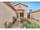 Inviting front entrance with desert landscaping, a tiled walkway, and a cozy bench at 22412 N 20Th Pl, Phoenix, AZ 85024