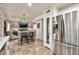 Bright kitchen featuring stainless steel appliances, tile flooring, island with bar stool seating and an open floor plan at 22412 N 20Th Pl, Phoenix, AZ 85024