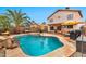 Inviting backyard pool with patio, BBQ, palm tree, and covered seating area perfect for outdoor entertaining at 22412 N 20Th Pl, Phoenix, AZ 85024