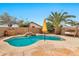 Outdoor oasis with a refreshing pool, rock waterfall feature, lush landscaping, and a relaxing swing at 22412 N 20Th Pl, Phoenix, AZ 85024