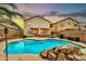 Stunning backyard pool with comfortable seating, BBQ grill, and ample entertaining space at 22412 N 20Th Pl, Phoenix, AZ 85024