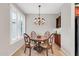 Elegant dining room with a decorative chandelier and window shutters at 2404 W Muirfield Dr, Anthem, AZ 85086