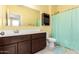 Bathroom with a single vanity, large mirror, tile floors, and shower at 28916 N Selenite Ln, San Tan Valley, AZ 85143