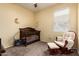 Bedroom room with a crib, rocking chair, and a window with blinds at 28916 N Selenite Ln, San Tan Valley, AZ 85143