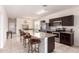 Spacious kitchen featuring granite countertops, stainless steel appliances, and an island with bar seating at 28916 N Selenite Ln, San Tan Valley, AZ 85143