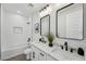 Modern bathroom showcasing dual sinks, marble countertop, and a separate tub/shower at 35597 W Jones Ave, Tonopah, AZ 85354